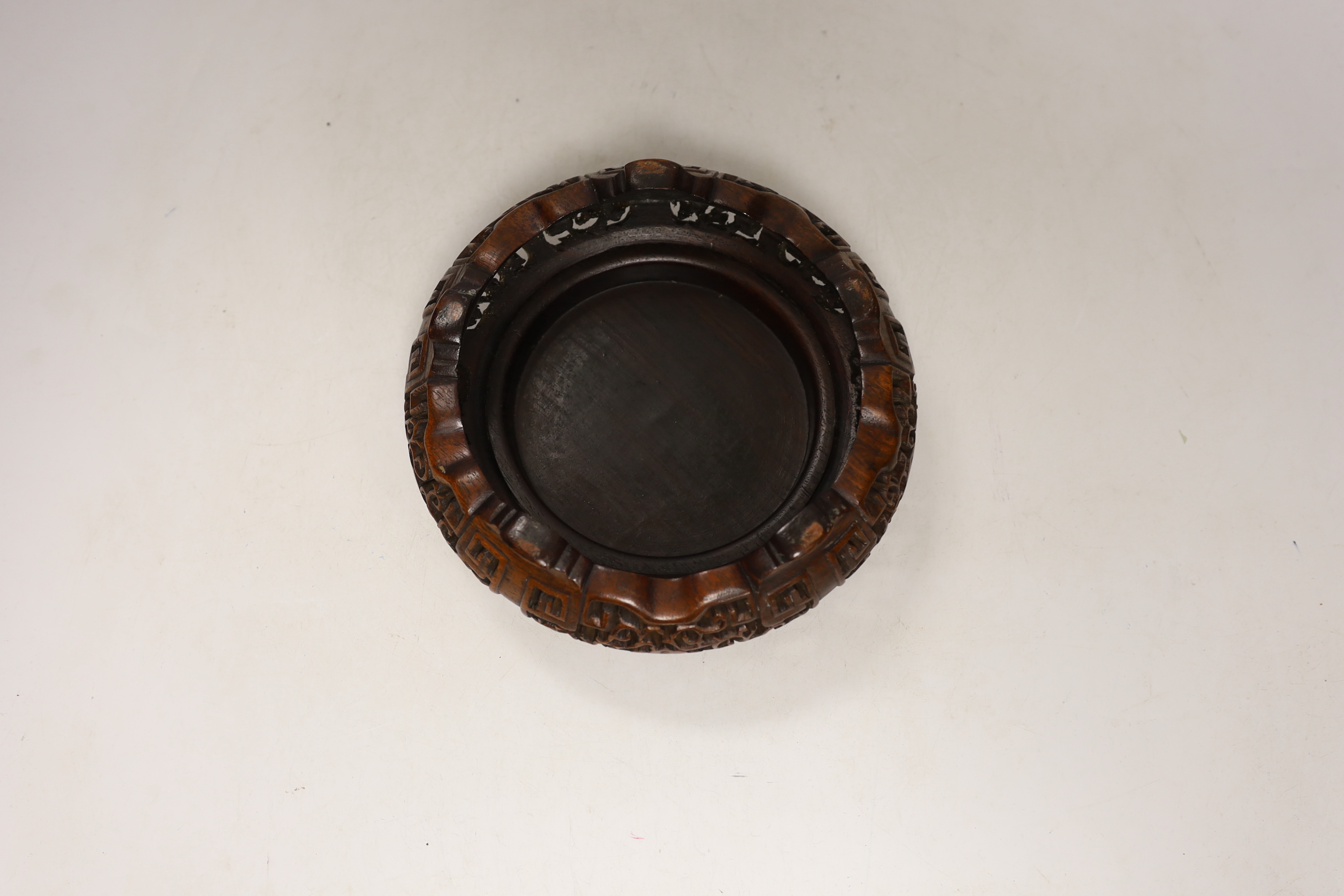 A Chinese hongmu stand, early 20th century, 19cm in diameter